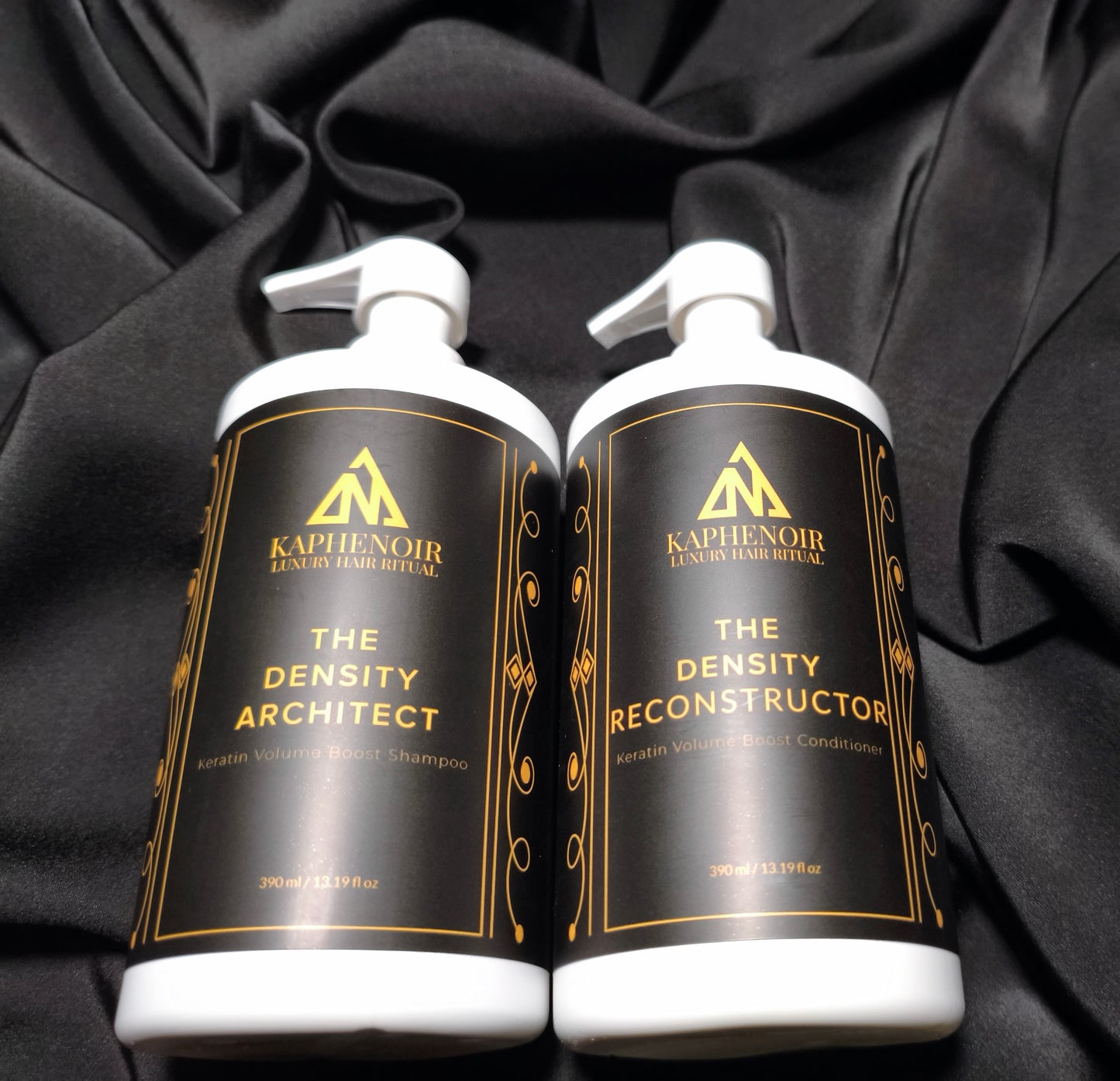 KapheNoir luxury hair care shampoo and conditioner bottles on black satin fabric