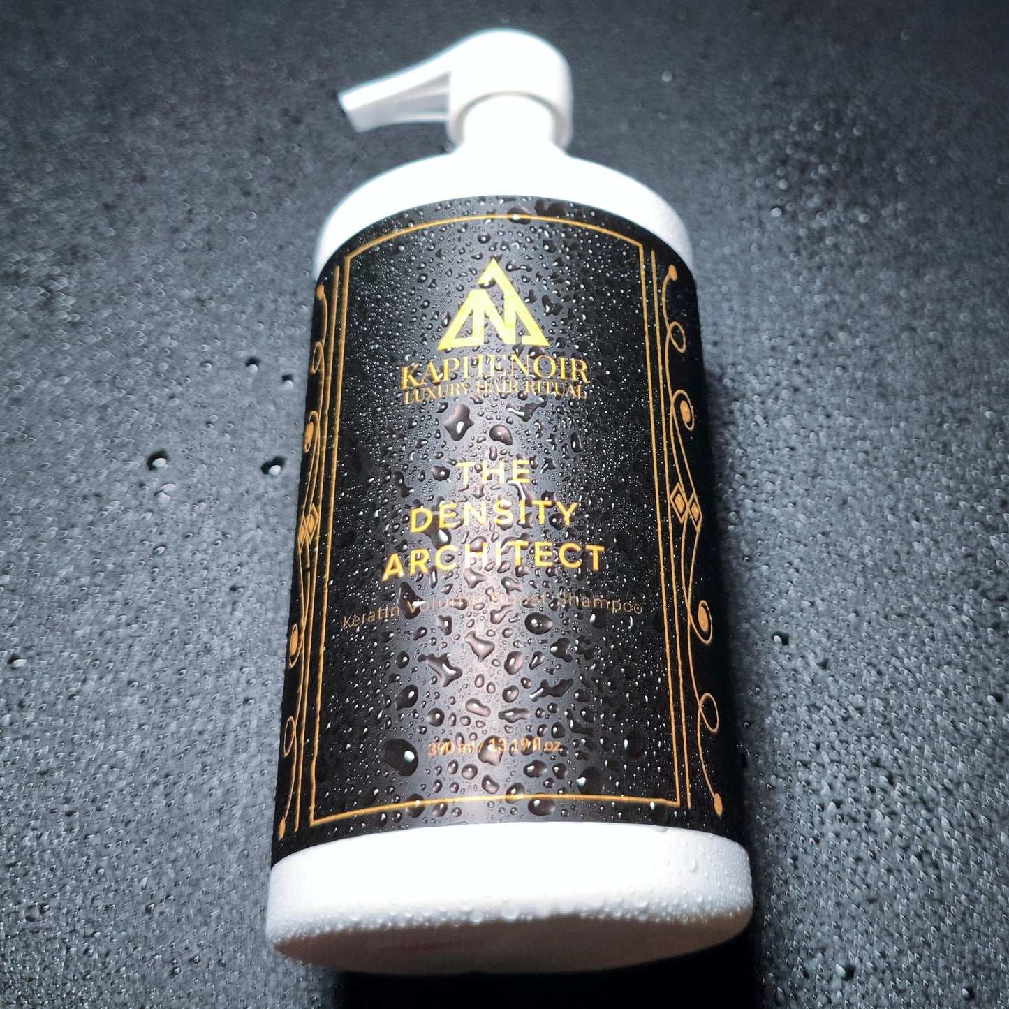 KapheNoir shampoo bottle on a textured black background