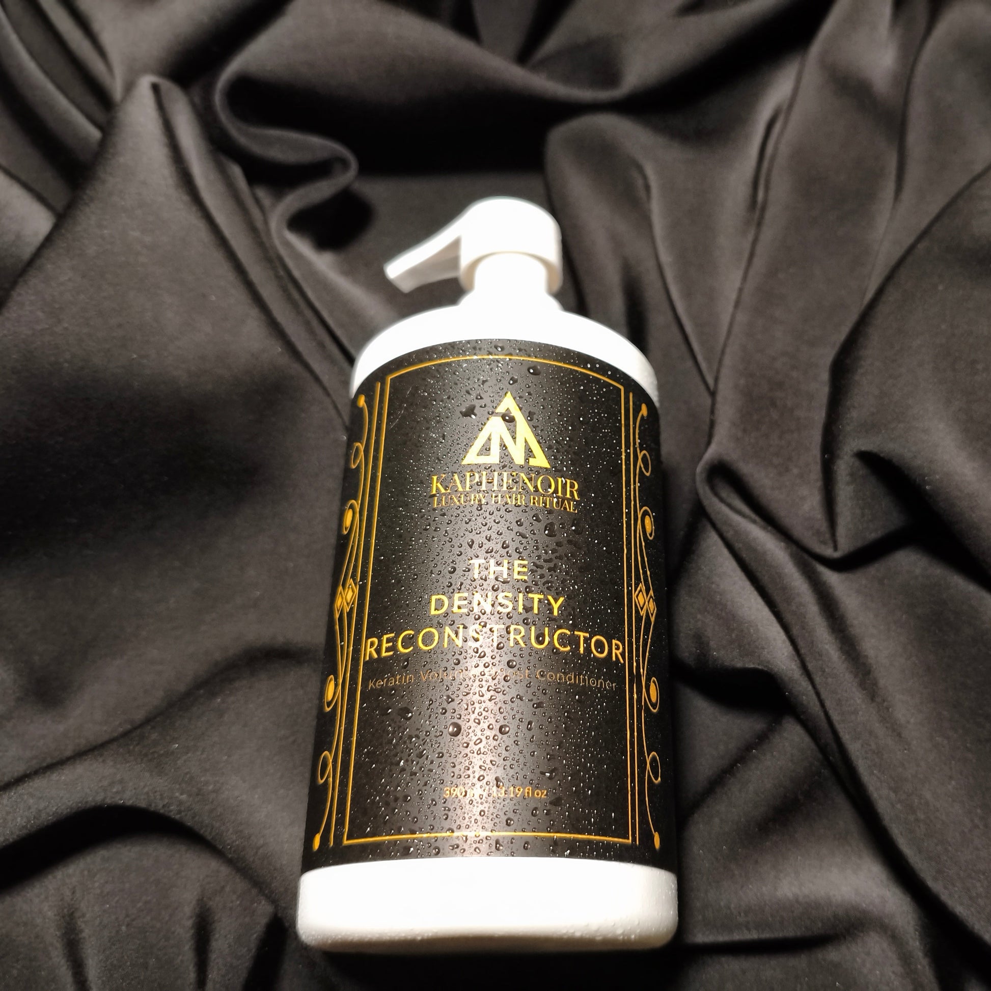 KapheNoir Density Reconstructor bottle on black fabric background