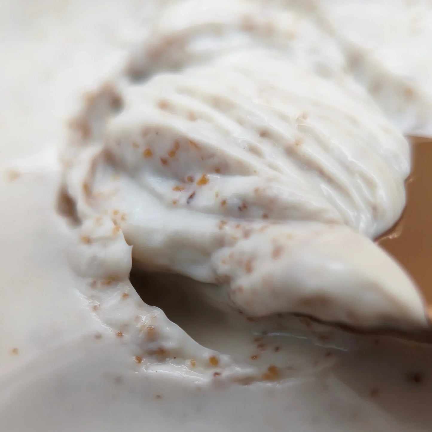 The Root Prep scalp scrub texture with exfoliating particles close up